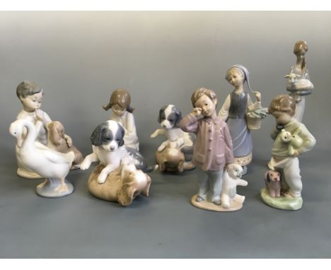 Six Nao and four Lladro figurines including boy with teddy, two dogs playing, swan, girl with lamb, etc.