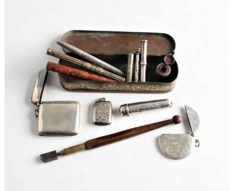 A collection of items, to include three vesta cases, a cheroot holder and cheroot, various pens and propelling pens, an inkwe