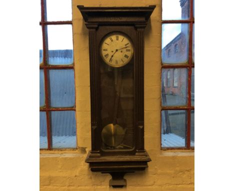 A regulator oak cased wall clock.