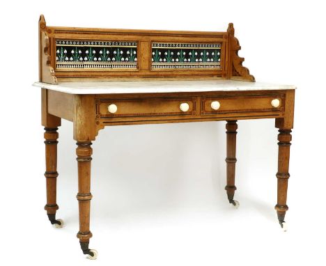An Arts &amp; Crafts pine, marble topped and tiled back washstand,c.1900, the rounded marble top with a snow drop tile back, 
