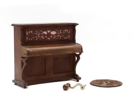 A Helvetta upright piano form disc musical box,playing 11.5cm discs, complete with three discs,23cm wide11cm deep 21.5cm high