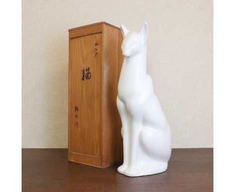 A Japanese Tobeyaki porcelain okimono, Showa period (1926-1989), of a seated cat with a white glaze,  59.5cm high, with origi