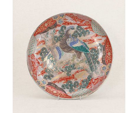 A Japanese ko-kutani charger,Meiji period (1868-1912), the rounded sides rising from a circular foot, painted with two birds 