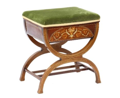 An Edwardian mahogany, boxwood and ivory inlaid stool,the hinged stuff-over seat opening to reveal a void interior, raised on