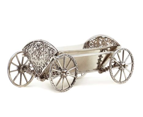 A Harrods silver bon bon trolley,London 1969, with a removable liner, to pierced floral and foliate ends, on four wheels,18.5