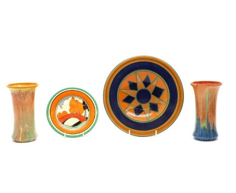 A collection of Clarice Cliff items,to include a side plate with a bridge scene, a starburst plate, and two Delicia spill vas