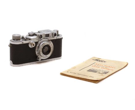 A Leica III camera,serial number 339111, circa 1936, fitted with a 5ccm 1:3,5 lens, complete with a 'lens tables' bookletCond