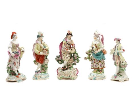 A group of five Derby porcelain figures,late 18th century, comprising, a lady with a basket of eggs, a shepherd, and three mu