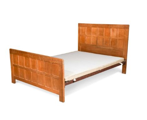 Robert ‘Mouseman’ Thompson, an oak 4' 6" bed, with adzed panelled head and footboards and iron rails117 x 138cmCondition repo