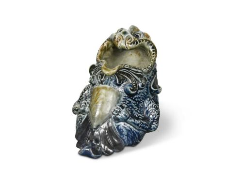 Robert Wallace Martin for the Martin Brothers, a stoneware spoon warmer, 1881, glazed in shades of cobalt and green and model