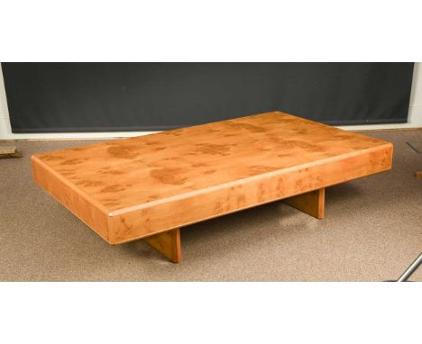 A modern Heal's burr oak coffee table, the rectangular top raised on two block supports, with inset metal disc36 x 160 x 96cm