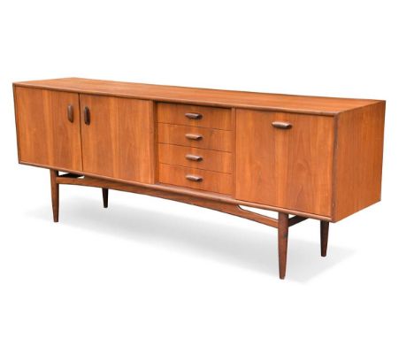 A G-Plan 'Sierra' teak sideboard, circa 1970s, the rectangular top above a pair of cupboard doors, four short drawers and a f