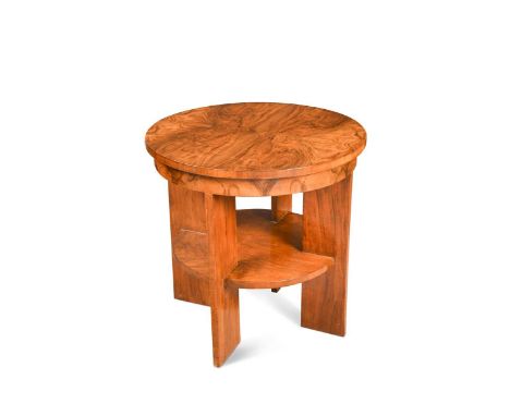 A good Art Deco figured-walnut coffee table, circa 1930, the well figured quarter-veneered circular top raised on four flat-s
