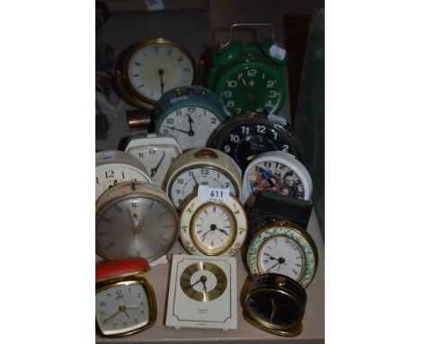 Fifteen vintage and retro alarm clocks, various colours, styles and eras.