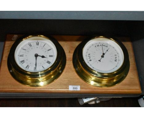A ships style barometer and clock with porthole design