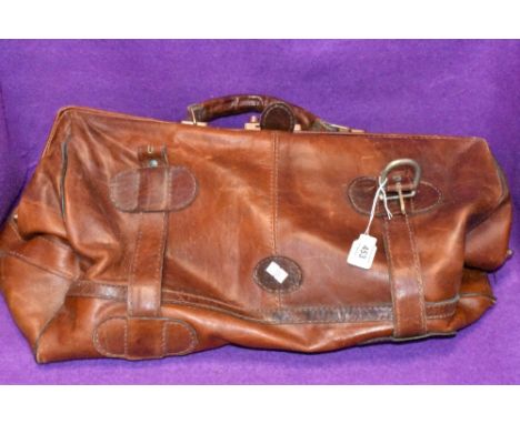 A vintage leather duffel or sports bag bearing label Topeu
No tears, age related wear to corners of framed area in places, ot