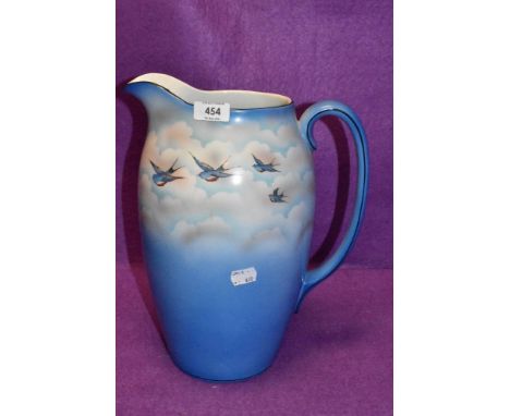 A large ceramic water jug by Palissy having Swift and sky design