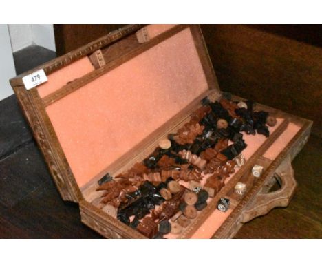 An Indonesian or similar style hand carved chess and games set complete
