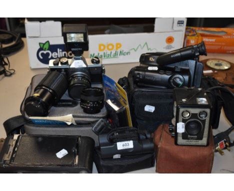 A mixed lot of vintage and retro cameras and camcorders including model D Brownie, Praktica and more.