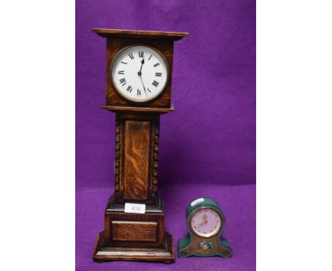 An Edwardian style miniature scale model of a long case clock and a similar version.
Approx 40cm height and 15cm&nbsp; width.