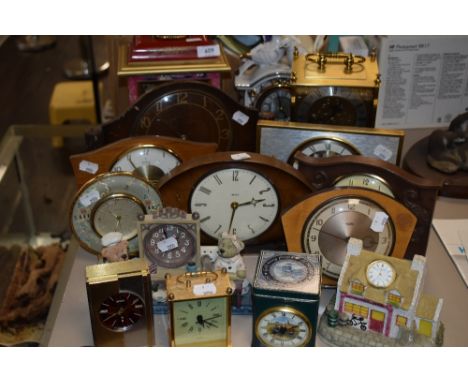 A mixture of clocks including vintage wooden examples and more.