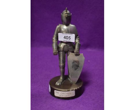 A Vintage table top cigarette lighter of a medieval knight with heavy weighted base