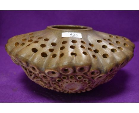An unusual piece of studio art pottery having earthen ware body and naturalistic design most likely a lamp shade