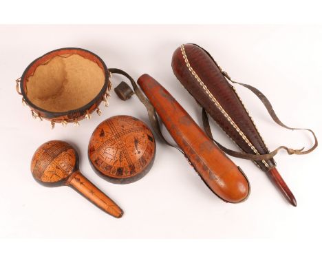 A MASAI MILK CONTAINER with incised horse decoration, 56cm long, another with applied beadwork decoration, 51cm long, a Burki
