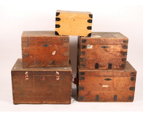 THREE METAL BOUND PINE TRAVELLING TRUNKS with lined interiors by Jeffcoat Brothers, two so labelled, 76cm and 61cm wide, a wo