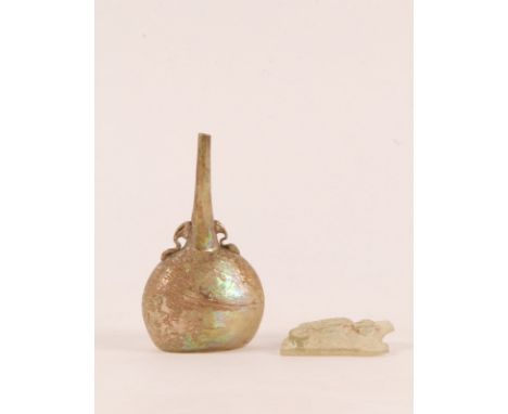 AN ISLAMIC GLASS FLASK with gold iridescent surface and stylised open work handles, perhaps Persia, 12th Century, 12cm high; 