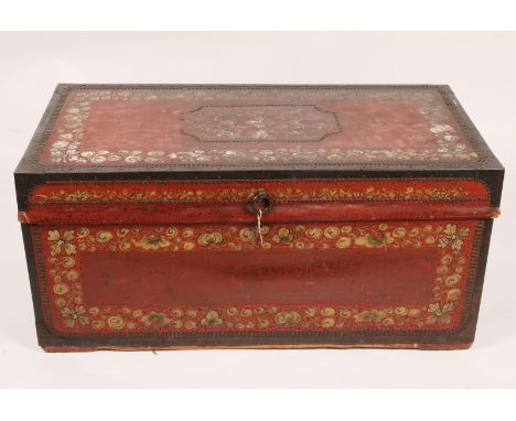 A 19TH CENTURY CHINESE PAINTED LEATHER ON CAMPHOR WOOD CLOTHES TRUNK with hinged rising lid, brass studded and foliate decora