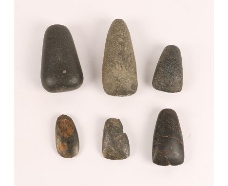 A COLLECTION OF SIX, POSSIBLY NIGERIAN, STONE AXE HEADS of simple tapering design (6)