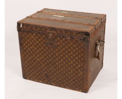 A LOUIS VUITTON LADIES CABIN TRUNK with stylised monogram decoration, metal and wooden bound, the interior fitted two slatted