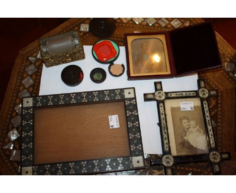 A BONE AND METAL INLAID PHOTO FRAME, a further bone mounted figure, a cased Daguerreotype of a seated gentleman, a stamp roll