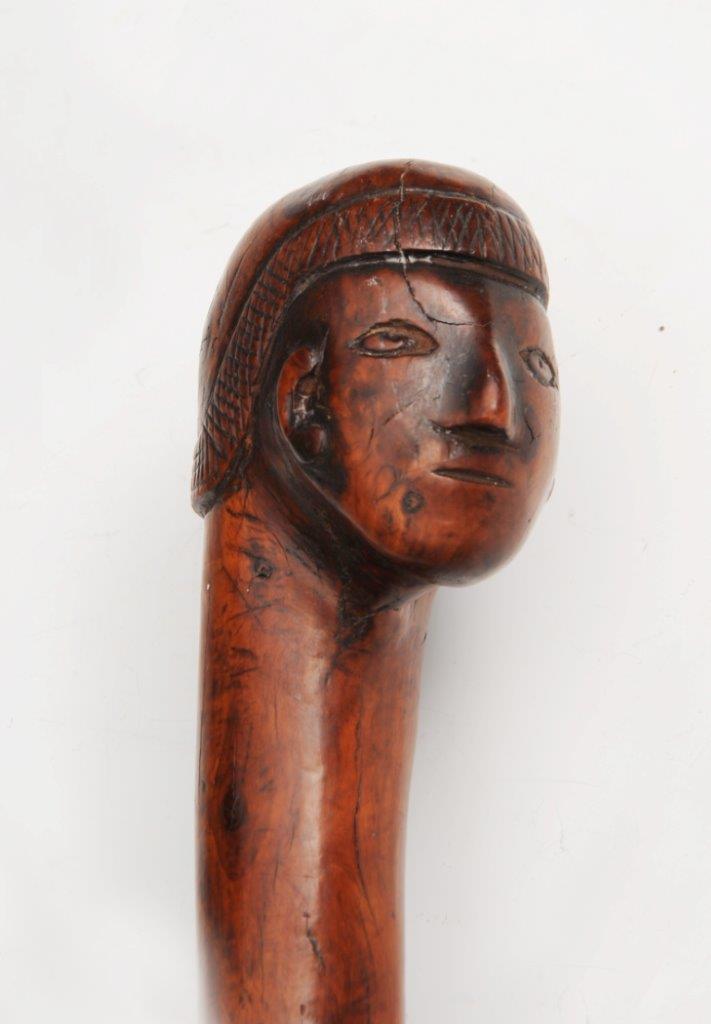 A SOUTH AMERICAN CARVED WOODEN TRIBAL STAFF with figure head handle ...