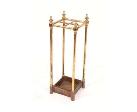 A VICTORIAN BRASS FOUR SECTIONAL STICK STAND with cast iron base, 61cm high