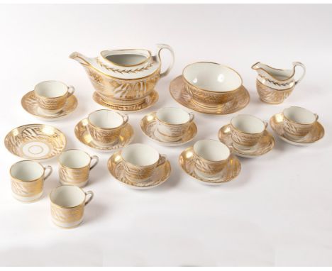 A John Rose Coalport gilt and white part tea and coffee service, decorated with a willow tree to each side and dot borders, c