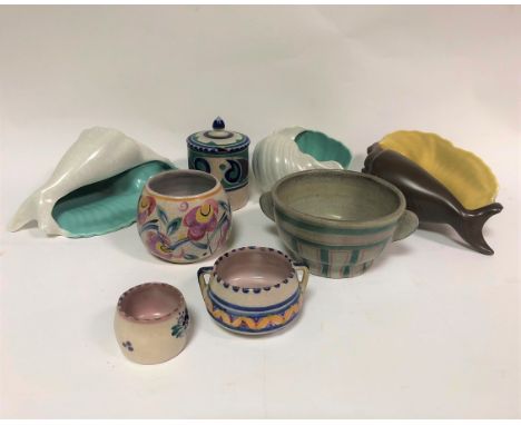 A Poole Pottery jam pot and cover, 11cm high, three Pool pottery ceramic shells, the largest 21cm wide and four bowls of vari