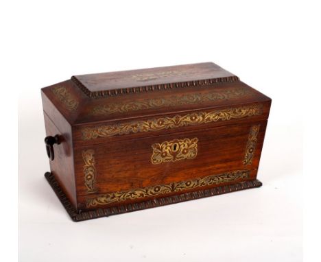 A Regency rosewood tea caddy of sarcophagus shape, inlaid brass decoration within knulled borders, fitted two hinged compartm