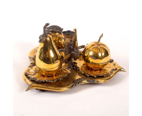 A Victorian silver gilt inkstand, Robert Hennell, London 1857, modelled as an apple, pear and pomegranate on a vine leaf, wit