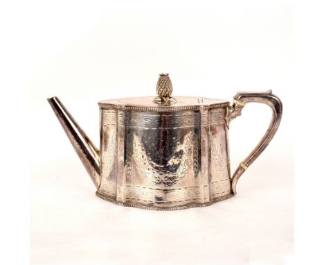 A Victorian silver teapot, WH, London 1870, of serpentine outline, engraved decoration and crest, pineapple finial, ivory hea