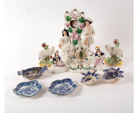 A group of Staffordshire figures including a watch stand and spill vases and five blue and white pickle dishes, various CONDI