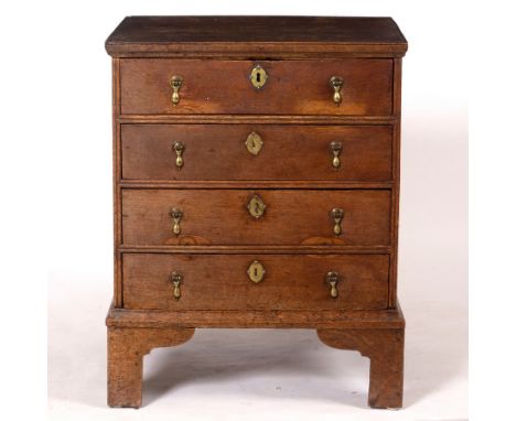 A late 17th Century style oak chest fitted four drawers on square feet, 56cm wide, 70.5cm high, 45cm deep CONDITION REPORT: T