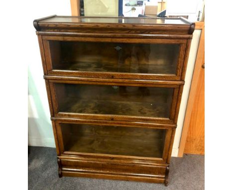 A Globe Wernicke oak bookcase with three glass fronted sections, 87cm wide CONDITION REPORT: The bookcase is in good conditio