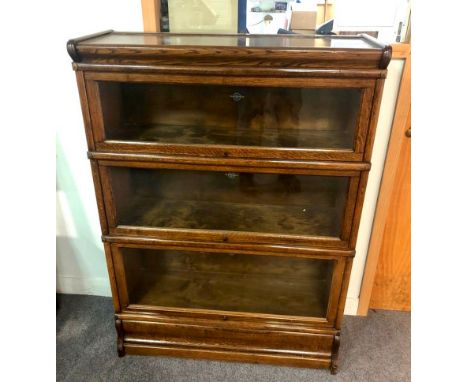 A Globe Wernicke oak bookcase with three glass fronted sections, 87cm wide CONDITION REPORT: The bookcase is in good conditio