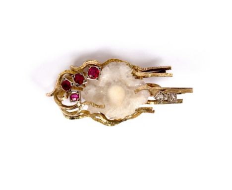 A gold and gem-set pendant, by Payne & Trigg, 1976, the quartz geode within an openwork mount formed of undulating and textur