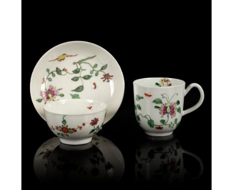 A Worcester tea bowl, coffee cup and saucer, circa 1755-60, painted in the Chinese style with the Hibiscus or Honeysuckle pat