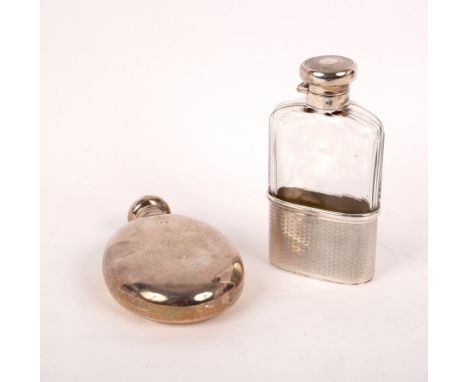 An oval silver hip flask, Birmingham 1900, with screw off cover, 12cm high and a silver mounted glass hip flask, Mappin & Web