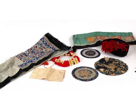 A Chinese silk embroidered apron, circa 1880, some sleeve bands, a Cantonese silk embroidered panel and sundry textiles CONDI