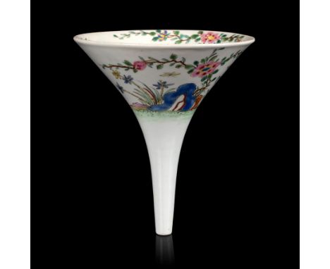 A Worcester wine funnel, circa 1754, painted in bright famille rose enamels with blue and orange rocks from which grows flowe